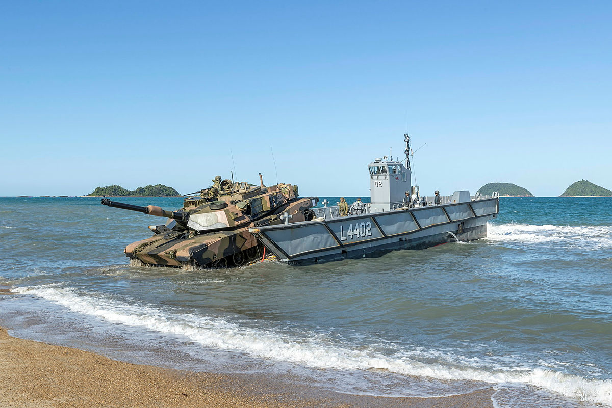 A tank disembarking from a transport ship to make an amphibious landing.