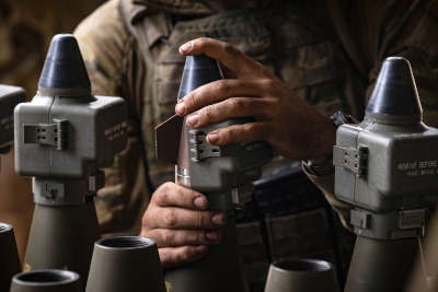 Royal Australian Artillery gunner prepares 155mm ammunition