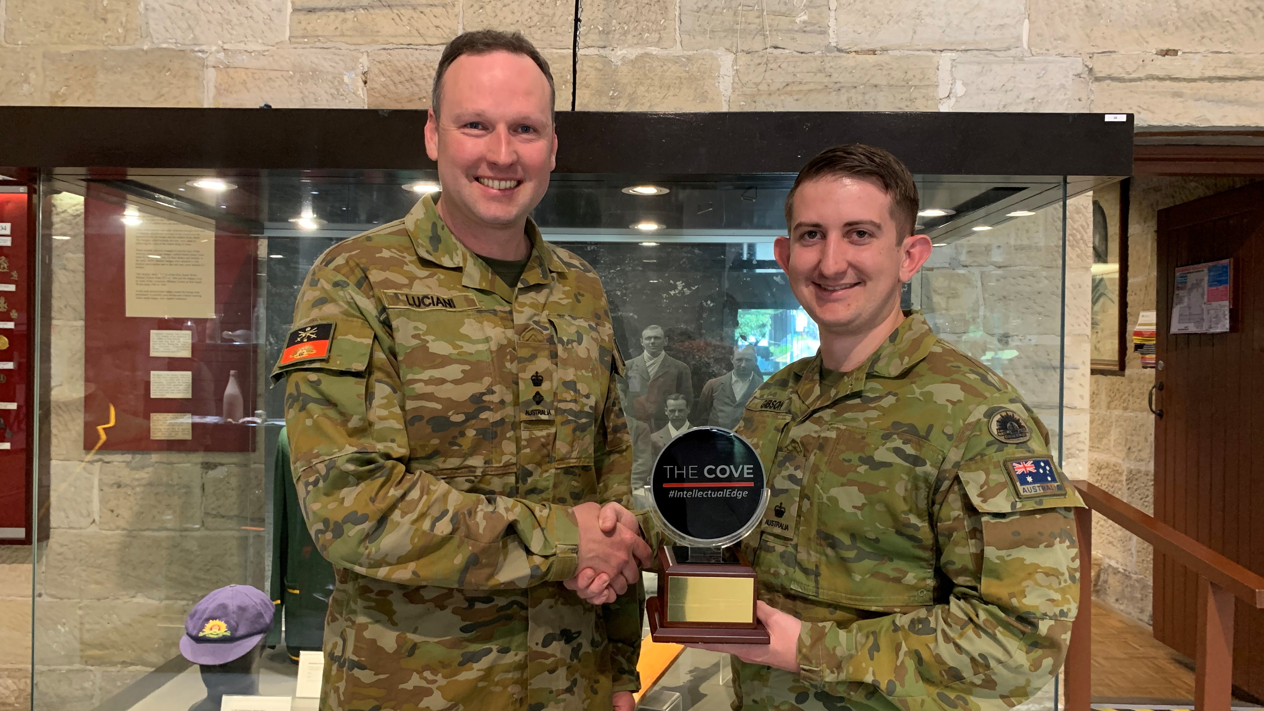 LTCOL Luciani presenting MAJ Gibson with his award.