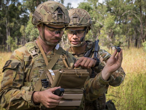 Australian Army soldiers Trooper Chris Perks (left) and Trooper Sam Menzies with a PD-100 Black Hornet Nano unmanned aircraft vehicle during training exercise at Shoalwater Bay Training Area, Queensland.