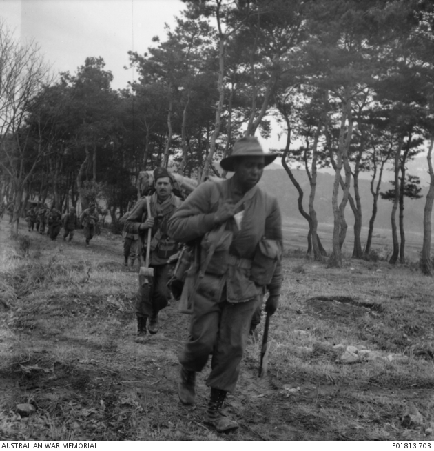 Captain Reginald Saunders leads his troops forward in Korea.