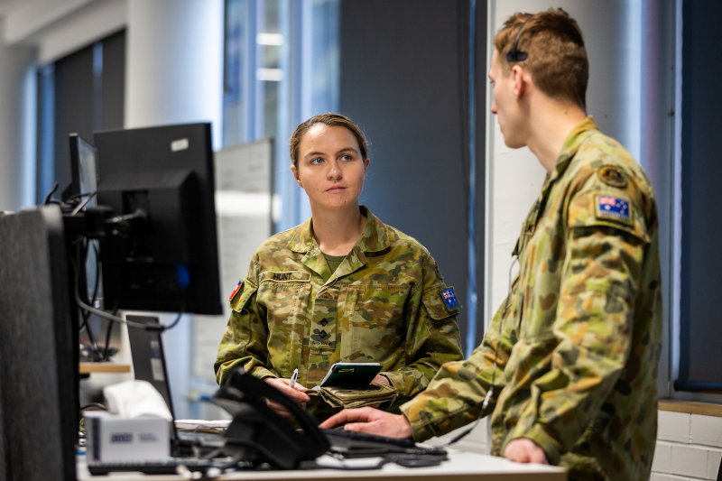 People standing at computer