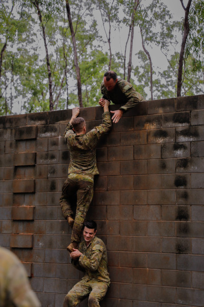 Soldiers scaling a wall