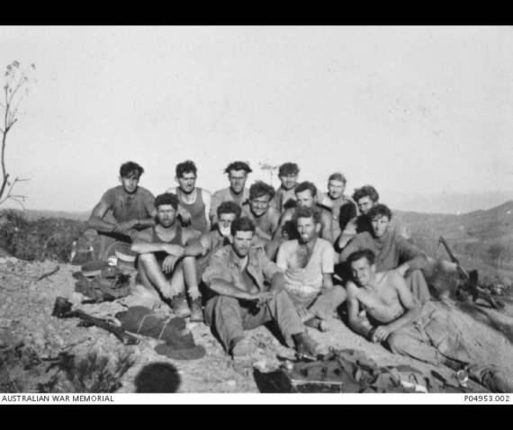 3 RAR soldiers sitting on a hill.