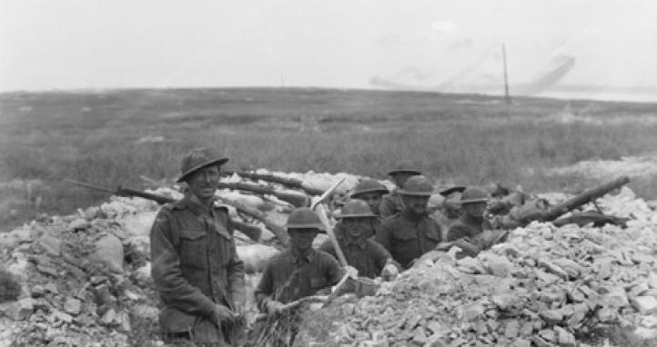 American and Australian soldiers in a trench.