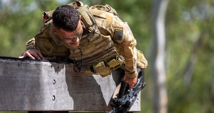 Soldier going over wall.
