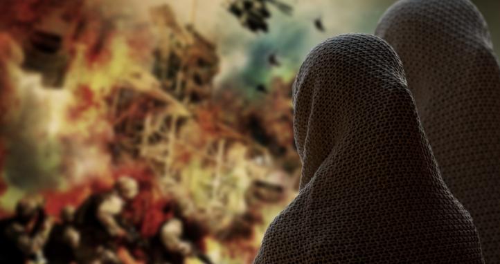 Two women looking at a painting.