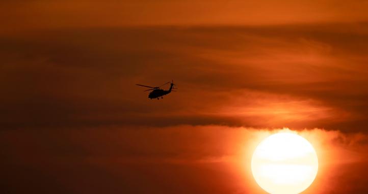 A helicopter flying.