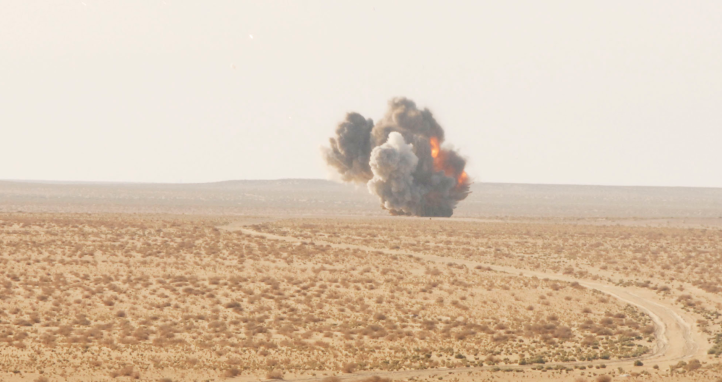 Demolition of 155mm artillery shells underway in Iraq.