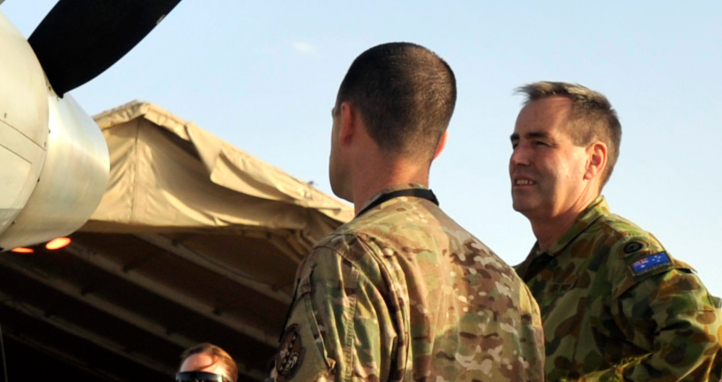 451 Operations Group Commander, US Army Colonel shows Chief of Air Force, Air Marshal the power-plant of a MQ-9 Reaper during a visit to Kandahar Airfield.