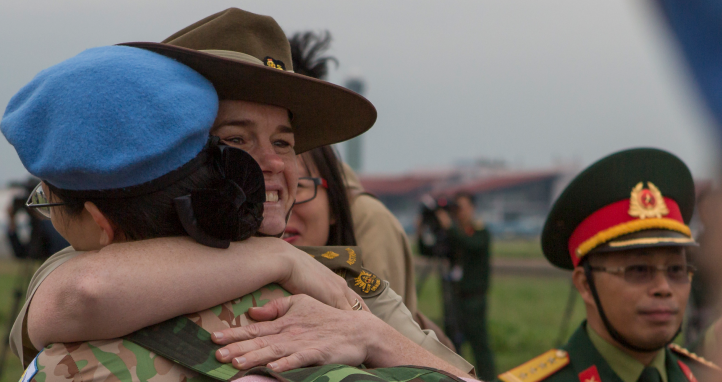 Australian Defence Attache - Hanoi Colonel farewells Vietnam People's Army medical officer.
