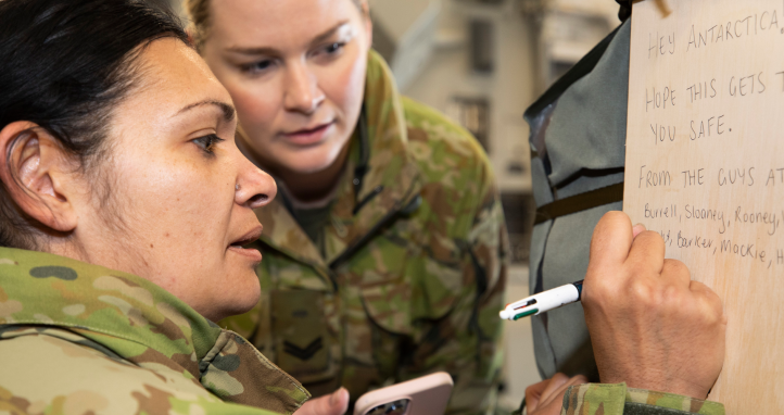Soldiers writing a goodbye message.
