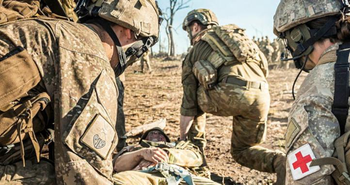 Medics attend to a soldier