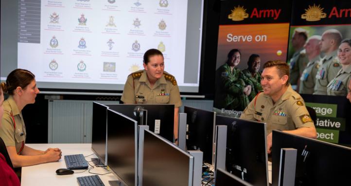 An Australian Army career manager delivers a presentation to soldiers.