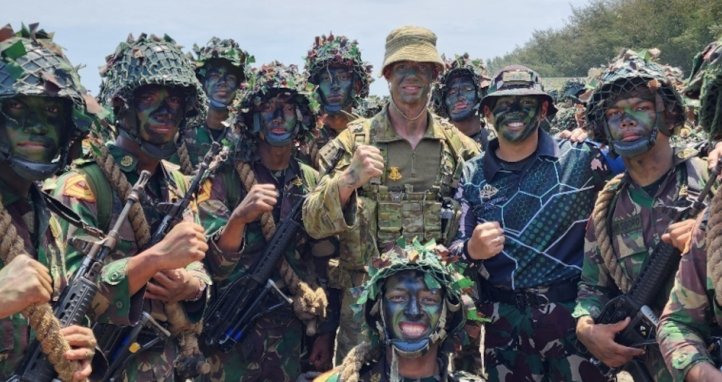 CAPT Damon Radford celebrates with Indonesian Akademi Militer Cadets from his Company after completing the culminating activity of Exercise Pramuka Yudha on 01 March 2024.