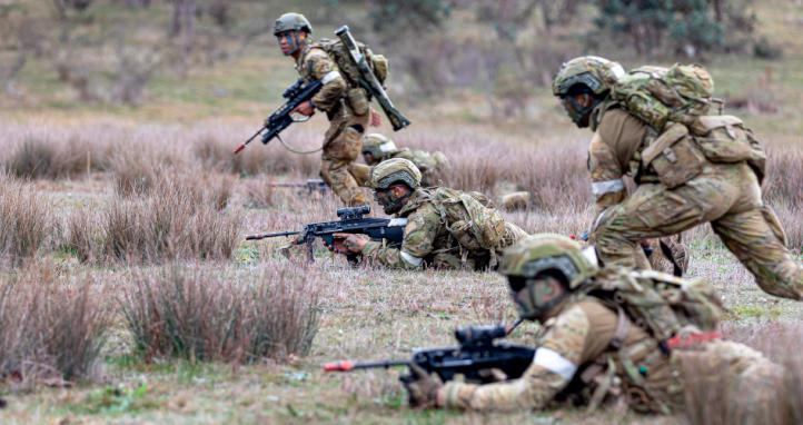 Staff Cadets from Training Team - Bravo, of the Royal Military College - Duntroon continue to move as they conduct their attack of Objective Hammer during Exercise War Fighter in Puckapunyal, Victoria.