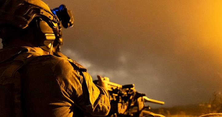 A soldier using night vision.