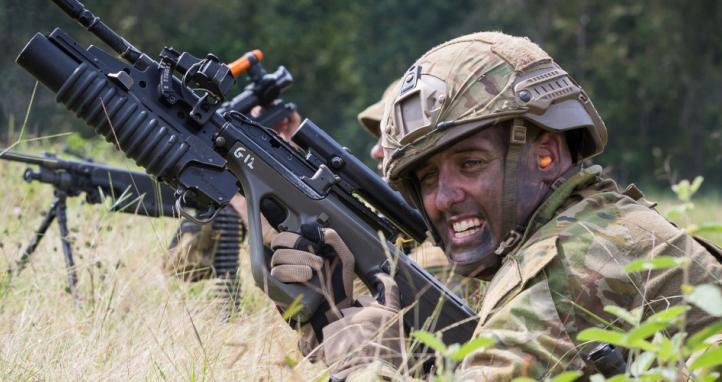 An Australian Army soldier reloads his weapon at a field firing range.