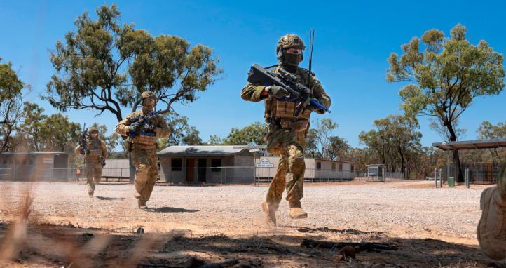 Australian Army soldiers move to cover during a clearance of Line Creek Junction during an exercise.