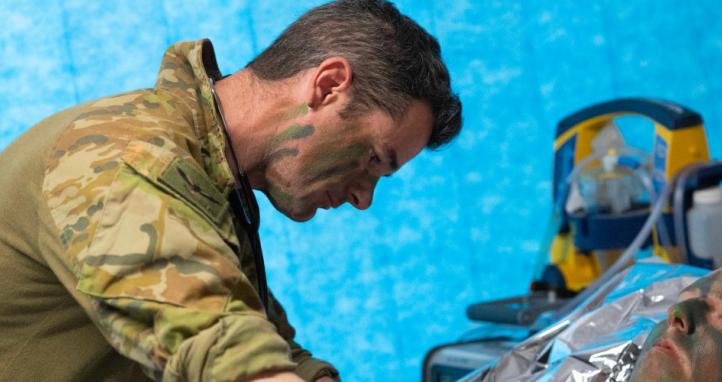 An Australian Army medic treating a simulated patient.