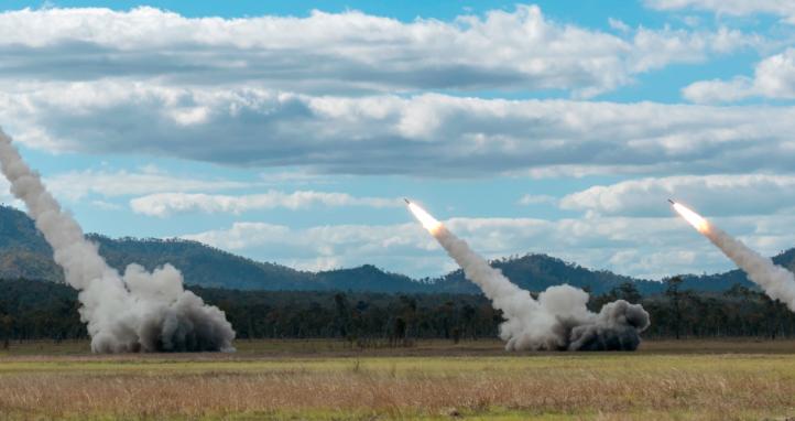 Three Australian Army High Mobility Artillery Rocket System (HIMARS) launch rockets.
