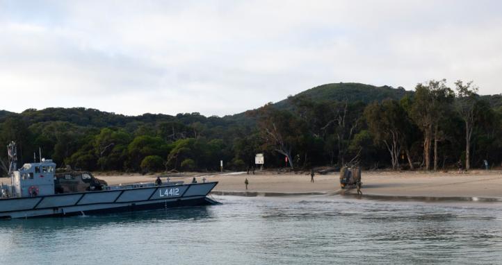 Royal Australian Navy LHD Landing Craft land ashore.