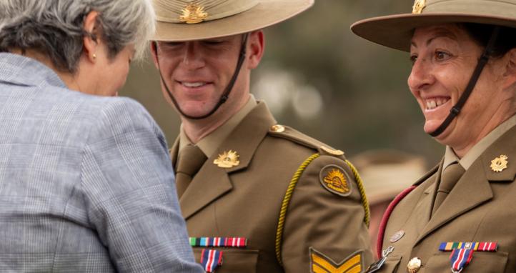 Australian Army Sergeant Kylie Guarino receives her King's Coronation Medal from Her Excellency Victoria Treadell CMG, MVO.