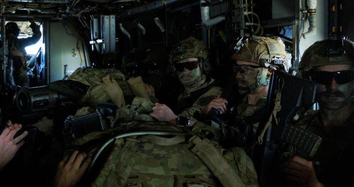 Soldiers being lifted by a MV-22B Osprey.