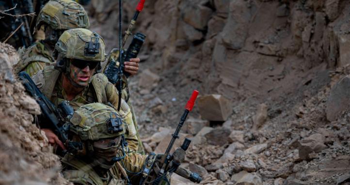 Australian Army soldiers prepare to engage targets during a trench clearance.