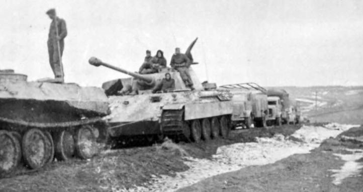 An early Panther towing an immobile tank.