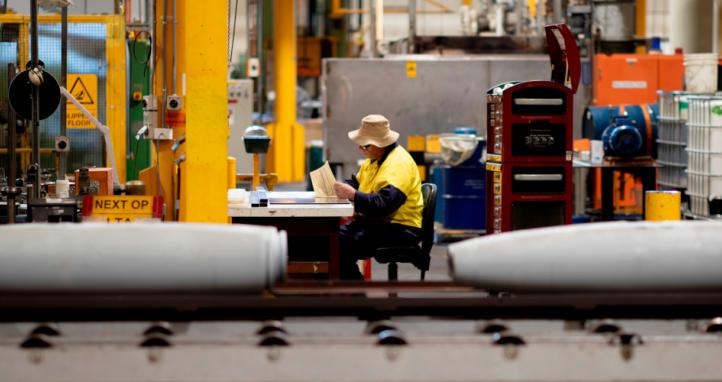 Thales Australia employee examining munitions – partway through the manufacturing process at the Benalla, VIC production line.