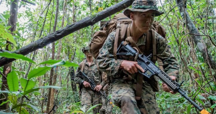 United States Marine Lance Corporal Kevin Martinson from Marine Rotational Force – Darwin patrols through the Combat Training Centre - Jungle Training Wing, Tully, Queensland.