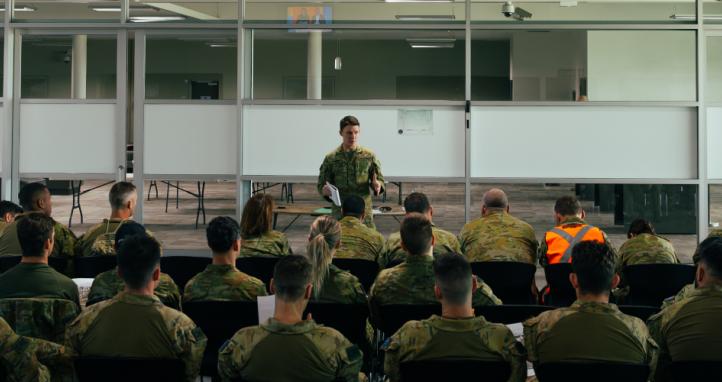 An officer delivers a brief to Australian Defence Force personnel.
