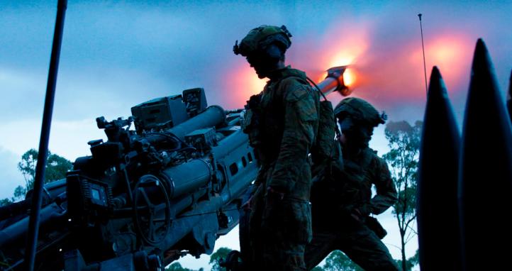Australian Army gunners from 4th Regiment, Royal Australian Artillery, fire a M777 howitzer during Exercise Brolga Walk in Townsville field training area, Queensland.