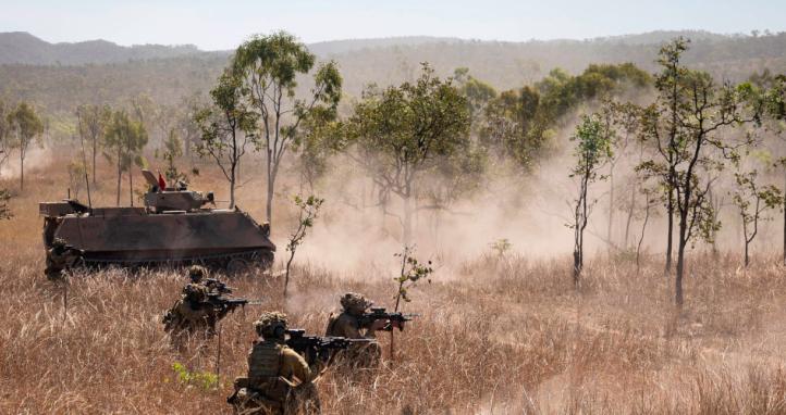 Australian Army soldiers conduct a dismounted assault during a Heavy Armoured Capability System live fire serial.
