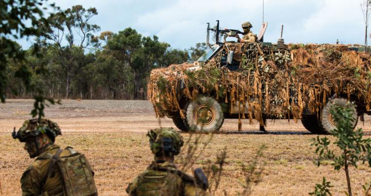 Australian Army soldiers from the 6th Battalion, The Royal Australian Regiment arrive at Exercise Diamond Run by Bushmaster Protected Mobility Vehicle, at Shoalwater Bay Training Area.