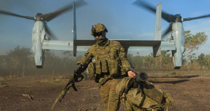 An Australian soldier arrives at Mount Bundey Training Area after travelling on a United States Marine Corps MV-22B Ospreys.