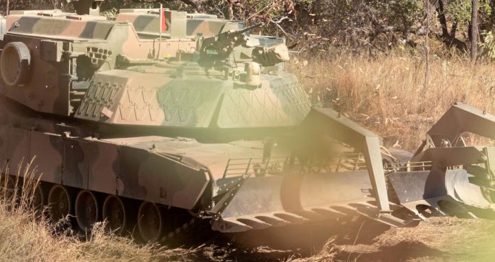 An Australian Army M1150 Assault Breacher Vehicle (ABV) conducts live-fire breaching serials.