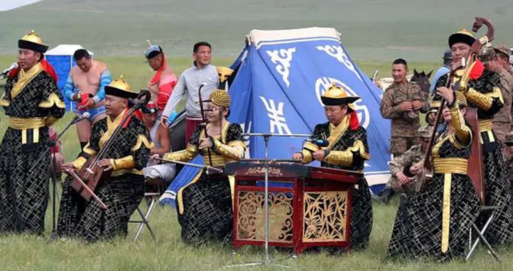 Mongolians perform throat singing during a mini-Naadam