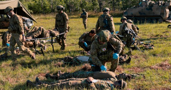 Australian Army soldiers simulate rendering first aid to casualties.