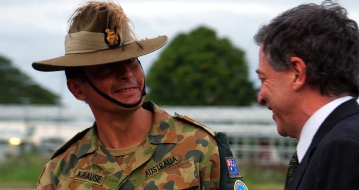 The Honourable Robert Hill, Minister for Defence is greeted by Military Adviser to Special Coordinator, RAMSI Colonel Michael Krause at Honiara International Airport.