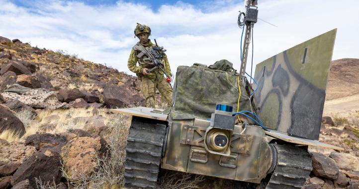 An Australian Army soldier from 1st Armoured Regiment with the 'Warfighter' uncrewed ground vehicle equipped with a prototype communications system during Project Convergence Capstone 5 at Fort Irwin, California, on 11 March 2025.