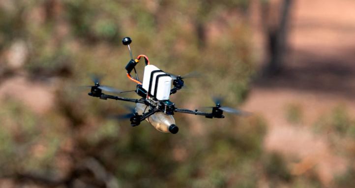 A drone operated by an Australian Army soldier conducts low-level manoeuvres.