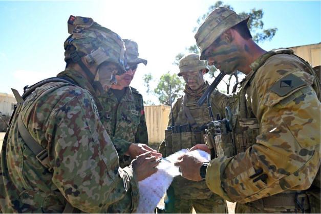 Australian Battery Commander and Japanese FSCC Commander planning subsequent mortar step up positions at OBJ Bear.