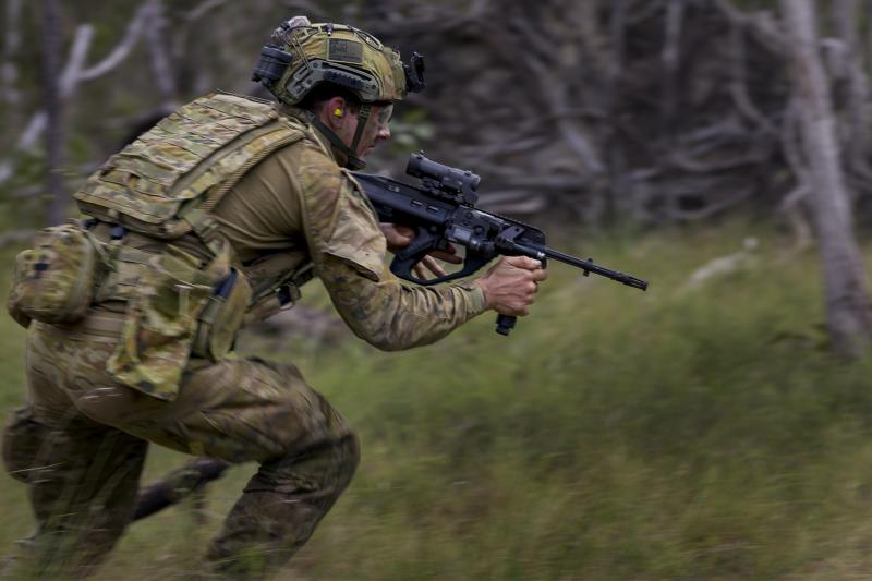 soldier running with rifle