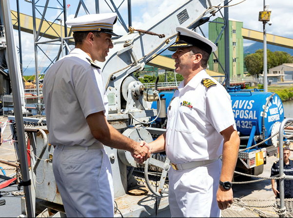 HMAS Cairns Commanding Officer Commander Alfonso Santos RAN (right) is greeted by La Fayette Commanding Officer, Frigate Captain Ghislain Deleplanque, during their visit to HMAS Cairns, Queensland. Source – ADF