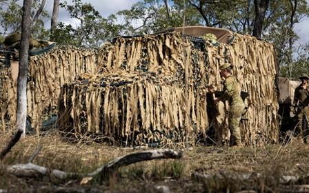 An Australian Army soldier prepares her G-Wagon.