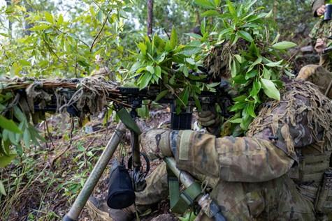 Australian Army Snipers conduct a support by fire mission.