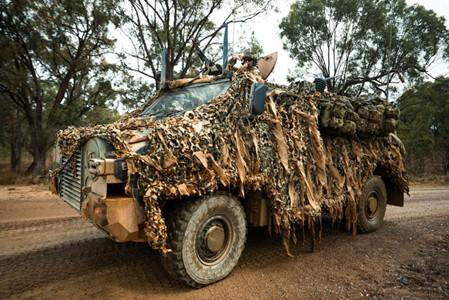 Australian Army soldiers in a Bushmaster Protected Mobility Vehicle.