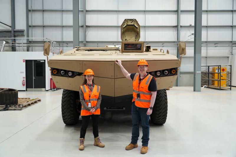 Shaun and Emma in front of tank
